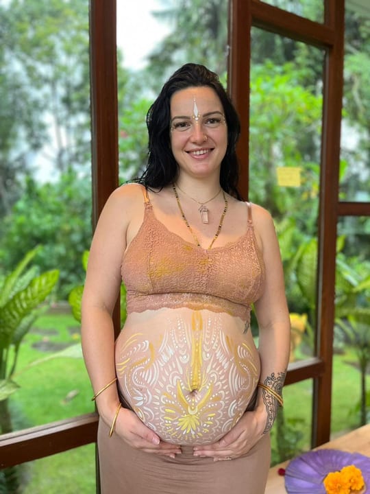 Mel, pregnant, with ceremonial belly painting